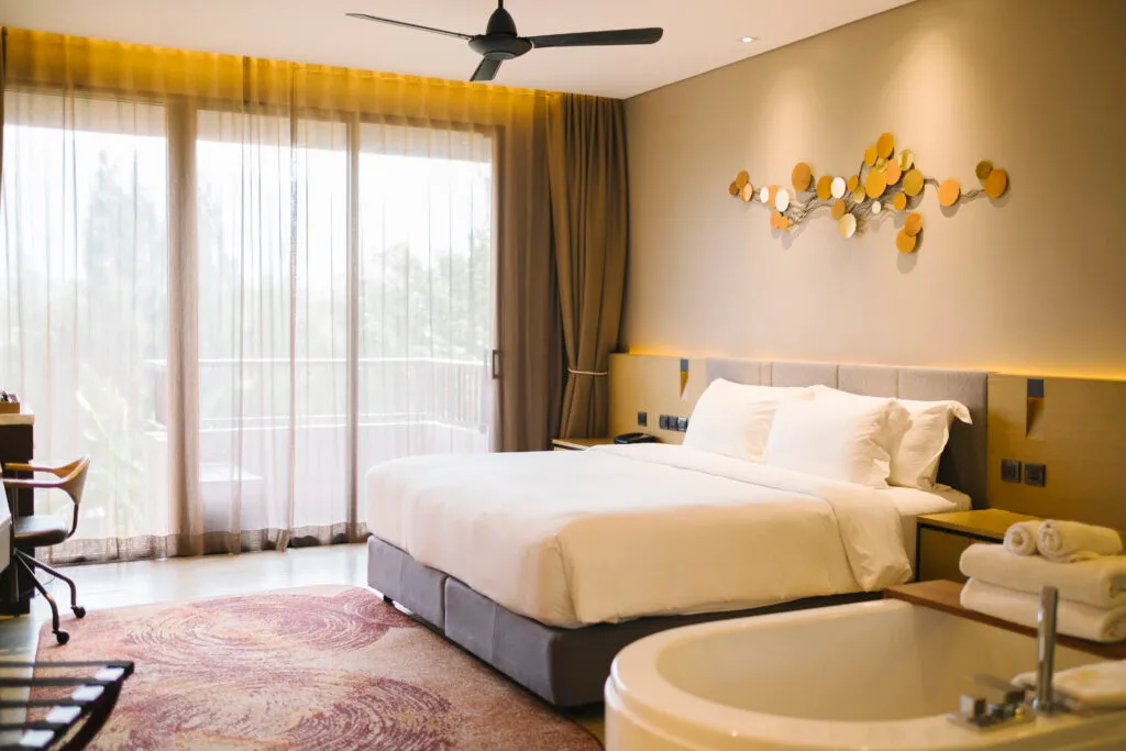 Luxury hotel room with bathtub and view, stay via Best Travel Agency in Kochi