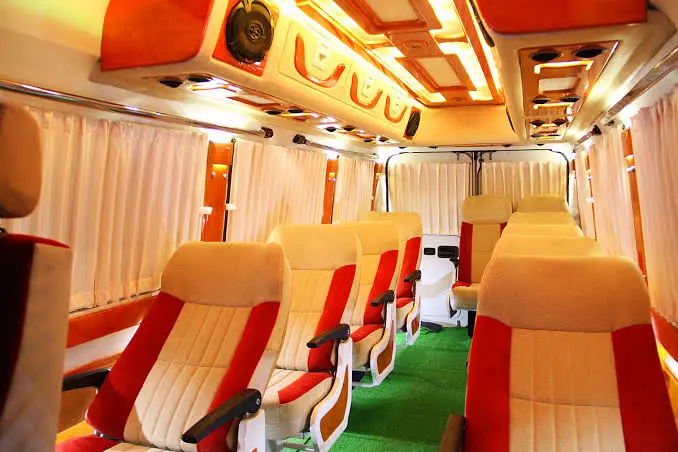 Spacious and comfortable AC luxury van interior for Kerala travel tours – safe and relaxing group transportation